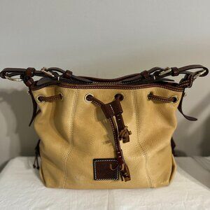 Vintage Dooney & Bourke leather bucket bag, tan and brown color.